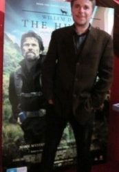 How does a first time film director lure a Hollywood heavyweight into his movie? (Willem Defoe in The Hunter)
